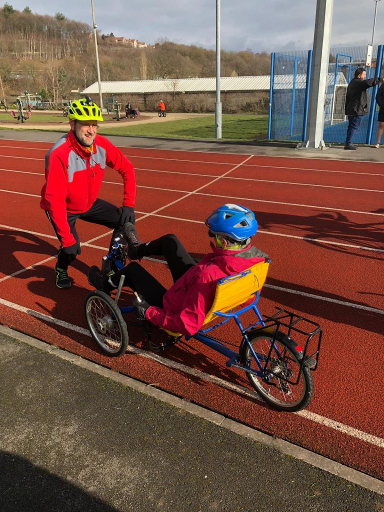 Barney watching Hilary on his recumbent trike