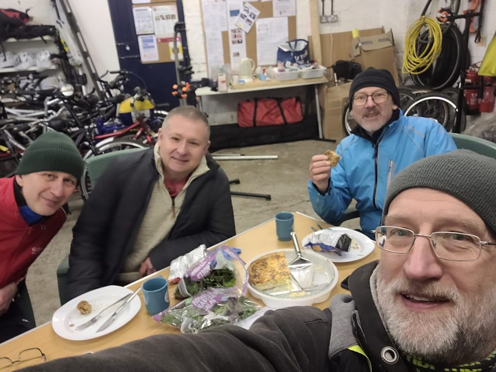 Picture shows 4 members of TT sat in the TT HQ enjoying a lunch break on the maintenance course.