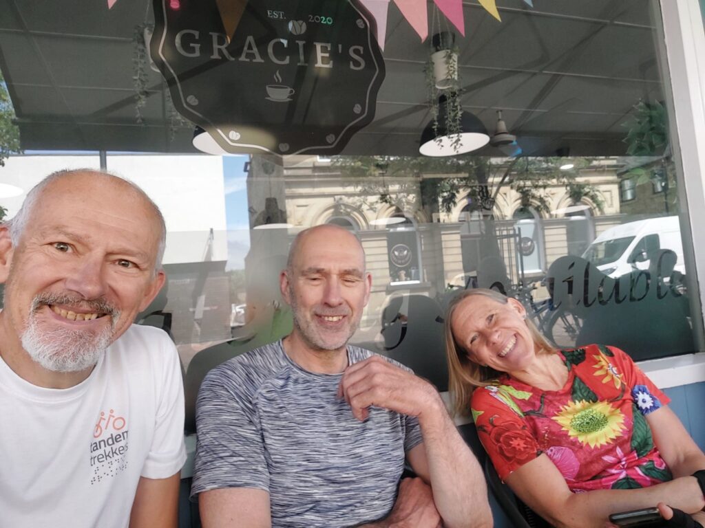Stevie, Colin and Lou outside Gracie's cafe